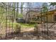 A lovely backyard featuring an arbor, lush greenery, a shed, and a charming wooden deck at 1767 Wingard Dr, Marietta, GA 30062