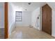 Unfinished basement space with tiled floors and a window at 1767 Wingard Dr, Marietta, GA 30062