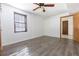 Comfortable bedroom with wood floors, a ceiling fan, and natural lighting at 1767 Wingard Dr, Marietta, GA 30062