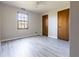 Spacious bedroom with gray walls, a ceiling fan, and two closets at 1767 Wingard Dr, Marietta, GA 30062