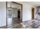 Open dining room with wood-look floors, chandelier, and access to the kitchen and outdoor patio at 1767 Wingard Dr, Marietta, GA 30062