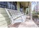 Relaxing porch swing on a stone-paved porch, offering a cozy spot to enjoy the outdoors at 1767 Wingard Dr, Marietta, GA 30062