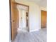 Hallway featuring hardwood doors and light gray, wood-look flooring at 1767 Wingard Dr, Marietta, GA 30062