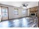 Bright living room featuring wood-look floors and a stone fireplace, creating a warm and inviting atmosphere at 1767 Wingard Dr, Marietta, GA 30062