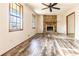 Bright living room with wood-look floors and a stone fireplace, creating a cozy focal point in the space at 1767 Wingard Dr, Marietta, GA 30062