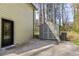 View of the home's exterior with a black door and a storage shed, perfect for extra space at 1767 Wingard Dr, Marietta, GA 30062