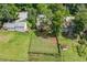 Backyard view from above, with a deck, fenced yard, mature trees and green grass at 3260 Sims View Ct, Snellville, GA 30078
