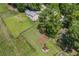Aerial view of house showing fenced backyard, shed, and mature trees surrounding property, ensuring privacy and space at 3260 Sims View Ct, Snellville, GA 30078