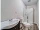 Bathroom with a vintage vanity, toilet, and walk-in shower with glass door at 3260 Sims View Ct, Snellville, GA 30078