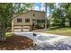 Charming home exterior with a well manicured lawn and driveway at 3260 Sims View Ct, Snellville, GA 30078