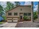 Charming two-story home featuring a two-car garage, inviting front porch, and manicured landscaping at 3260 Sims View Ct, Snellville, GA 30078