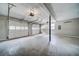 Spacious two-car garage with white doors and a concrete floor at 3260 Sims View Ct, Snellville, GA 30078