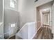 Light and bright entryway hallway featuring luxury wood-style flooring at 3260 Sims View Ct, Snellville, GA 30078