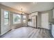 Open-concept kitchen featuring stainless steel appliances, granite countertops, and bright natural light at 3260 Sims View Ct, Snellville, GA 30078