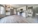 Modern kitchen with white cabinets, stainless steel appliances, and hardwood flooring at 3260 Sims View Ct, Snellville, GA 30078