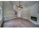 Bright and airy living room showcasing a vaulted ceiling, stone fireplace, and hardwood floors at 3260 Sims View Ct, Snellville, GA 30078
