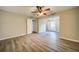 Spacious living room with neutral walls, wood-look flooring, and ceiling fan at 3260 Sims View Ct, Snellville, GA 30078