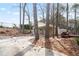 View of a large backyard with a carport, a small shed, trees, and ample space for outdoor activities at 34 Kelso At Peyton Dr, Atlanta, GA 30311