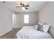 Comfortable bedroom with ample natural light, ceiling fan, and neutral tones at 34 Kelso At Peyton Dr, Atlanta, GA 30311