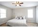 Inviting bedroom with plush bedding, natural light, and a modern ceiling fan at 34 Kelso At Peyton Dr, Atlanta, GA 30311