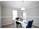 Bright dining room with modern lighting, gray walls, and white trim and table at 34 Kelso At Peyton Dr, Atlanta, GA 30311