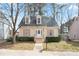 Charming bungalow-style home with dormer windows, a well-manicured yard, and a welcoming front porch at 34 Kelso At Peyton Dr, Atlanta, GA 30311