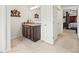 Bathroom with granite countertop, modern vanity, mirror, and beige tile flooring at 3316 Quarter Horse Ln, Conyers, GA 30013