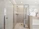 Modern bathroom featuring a glass-enclosed shower and a soaking tub, designed for comfort and relaxation at 3316 Quarter Horse Ln, Conyers, GA 30013