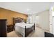 Bedroom featuring a bed, bedside tables, neutral decor, and a naturally lit window at 3316 Quarter Horse Ln, Conyers, GA 30013