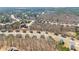 Expansive aerial view showing a well-planned residential community surrounded by trees and roads at 3316 Quarter Horse Ln, Conyers, GA 30013