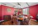 Formal dining room with hardwood floors, coffered ceilings, ample seating, and elegant finishes at 3316 Quarter Horse Ln, Conyers, GA 30013