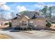 Inviting exterior view of a brick-facade building with a charming entrance and well-kept surroundings at 3316 Quarter Horse Ln, Conyers, GA 30013