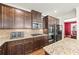 Kitchen with granite counters, stainless steel appliances, and a view into the dining room at 3316 Quarter Horse Ln, Conyers, GA 30013