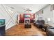 Comfortable living room with a fireplace, wood floors, and an accent wall with gold trim at 3316 Quarter Horse Ln, Conyers, GA 30013