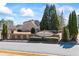 Attractive entrance to McArt Landing, featuring stone signage surrounded by manicured landscaping at 3316 Quarter Horse Ln, Conyers, GA 30013