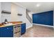 Finished basement features a bar area with wine racks, bar fridge, and accent wall at 4080 Glen Hill Ne Way, Marietta, GA 30066