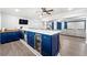 Beautiful basement bar featuring custom blue cabinets, wine fridge and modern countertops at 4080 Glen Hill Ne Way, Marietta, GA 30066