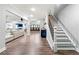 Spacious basement features a staircase, living area, bar, and a movie viewing area in the background at 4080 Glen Hill Ne Way, Marietta, GA 30066