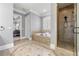 Elegant bathroom featuring a soaking tub, walk-in shower, and tile flooring at 4080 Glen Hill Ne Way, Marietta, GA 30066