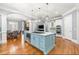 Stylish kitchen featuring a large center island with cooktop, stainless steel appliances, and open layout at 4080 Glen Hill Ne Way, Marietta, GA 30066