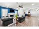 Spacious living room with a cozy fireplace, crown molding and luxury vinyl flooring at 4080 Glen Hill Ne Way, Marietta, GA 30066