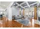 Spacious living room with coffered ceilings and French doors leading to a balcony at 4080 Glen Hill Ne Way, Marietta, GA 30066