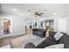 Beautiful living room with luxury vinyl flooring and access to the wet bar and media room at 4080 Glen Hill Ne Way, Marietta, GA 30066