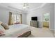Serene main bedroom features a tray ceiling, ensuite bathroom, and ample natural light at 4080 Glen Hill Ne Way, Marietta, GA 30066