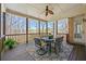 Relaxing screened porch with dining set and ceiling fan at 4080 Glen Hill Ne Way, Marietta, GA 30066