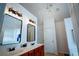 Bright bathroom featuring double sinks, updated fixtures, and modern lighting in a homey setting at 93 Richmond Way, Villa Rica, GA 30180