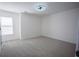 Neutral bedroom features carpeted flooring and a ceiling fan at 93 Richmond Way, Villa Rica, GA 30180