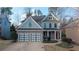 Charming two-story home featuring a two-car garage and a welcoming front porch at 93 Richmond Way, Villa Rica, GA 30180