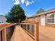 Exterior shot of a home featuring a spacious wooden deck with black metal railings at 248 Arnold Ave, Marietta, GA 30066