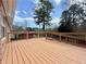 Wide angle shot of the wooden deck featuring black metal railings with trees in the background at 248 Arnold Ave, Marietta, GA 30066